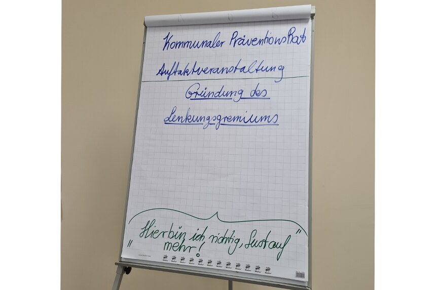 Flipchart mit dem Motto der Veranstaltung.