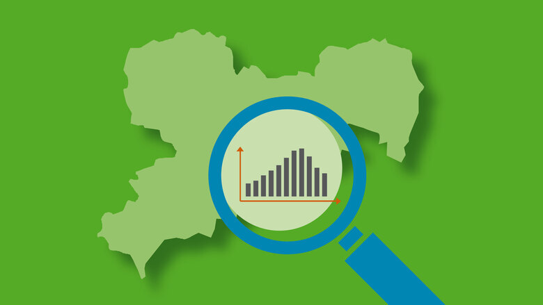 Logo der Sicherheitsanalysen von ASSKomm. Grüne Sachsen Karte mit einer Lupe, in der eine schwarze Statistik erscheint.