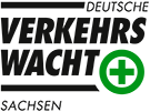 Schriftzug "Verkehrswacht" und ein grünes Kreuz in einem Kreis.