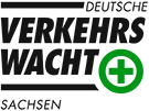 Schriftzug "Verkehrswacht" und ein grünes Kreuz in einem Kreis.