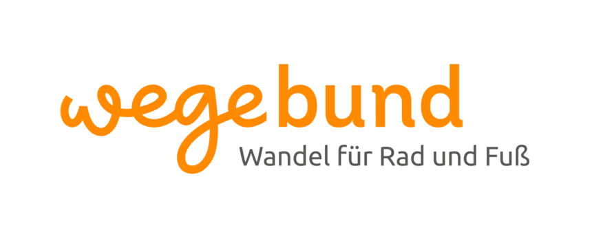 Das Wort "wegebund" steht in orange und einer Schreibschrift für sich allein.