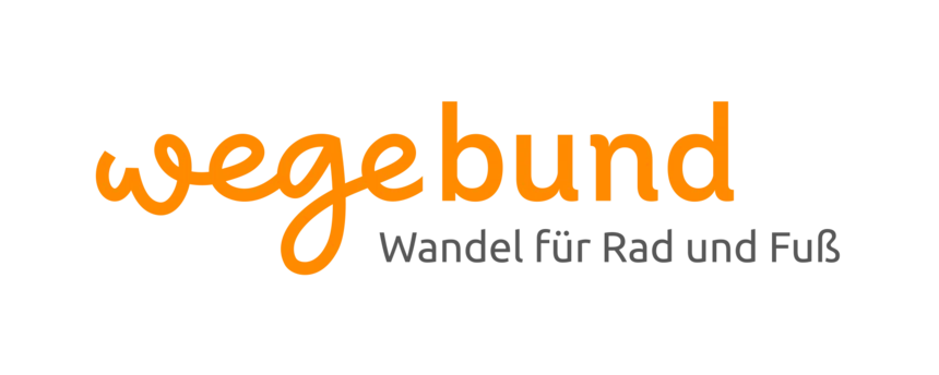 Das Wort "wegebund" steht in orange und einer Schreibschrift für sich allein.